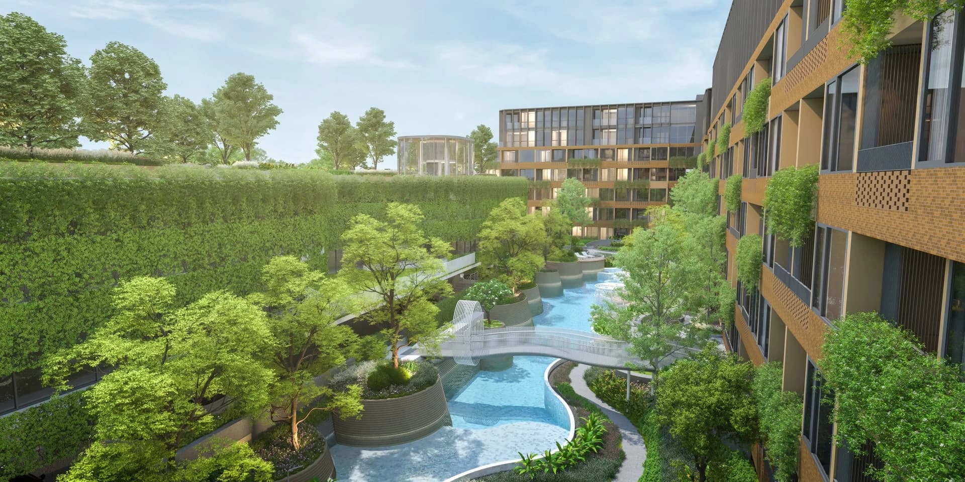 The courtyard of Arise Vibe: a stream pool with stepping stones between the planted wings